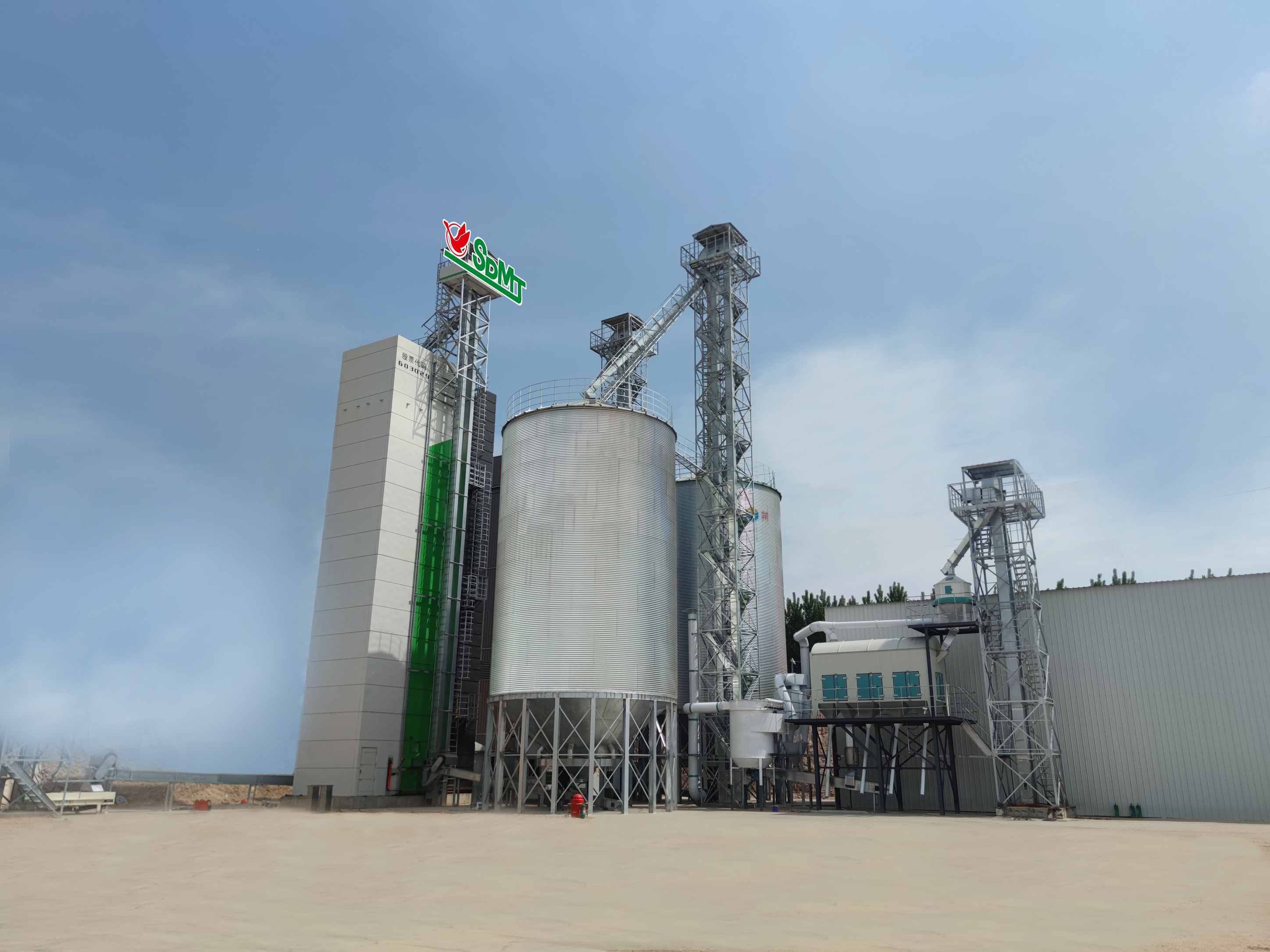 A system for thermal treatment of grain to reduce moisture content